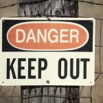 Photo of "Danger: Keep Out" sign on fence