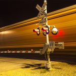 Photo of train passing by barrier