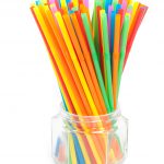Photo of colourful straws in small glass jar