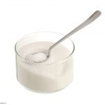 Photo of container with sugar and spoon