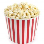 Photo of striped container filled with popcorn