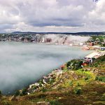 Photo of St. John's with mist over water
