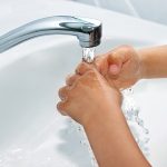 Photo of child washing hands