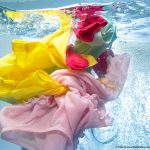 Photo of clothes in water inside washing machine