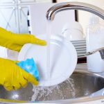 Photo of person washing dish