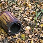 Photo of empty paint can thrown on ground