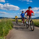 Photo of family cycling