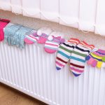 Photo of gloves drying on radiator