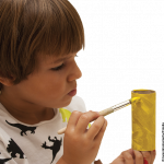 Photo of child painting toilet roll